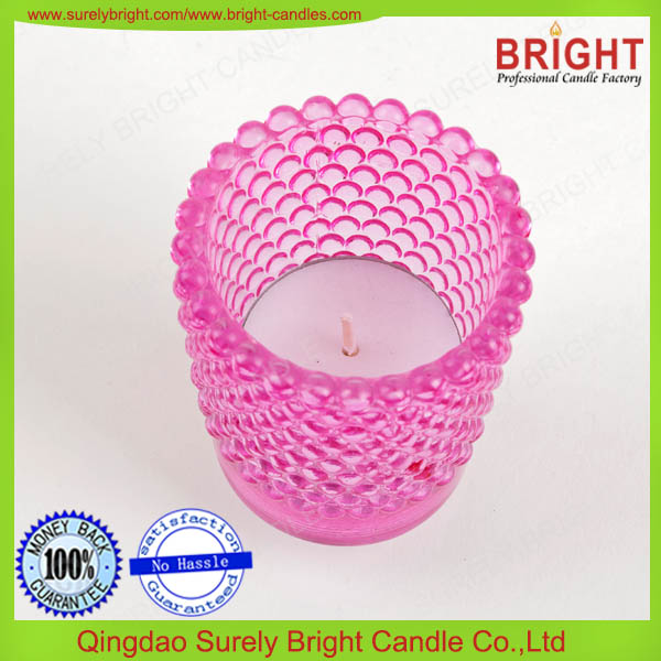 White tealight candle in glass candle holder