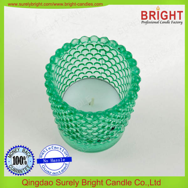 White tealight candle in glass candle holder