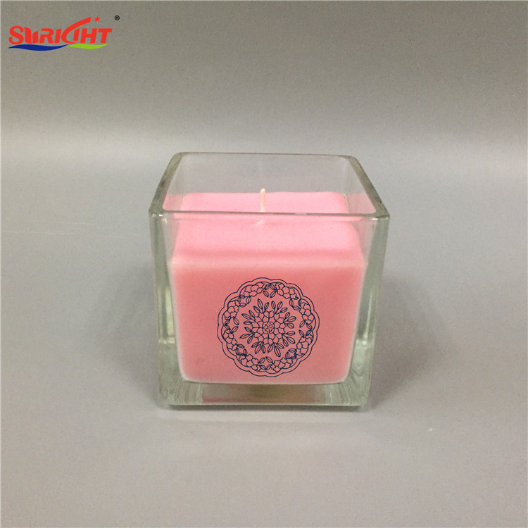 Vela aromatizante en vaso cristal transparente con imagen original y cera rosa